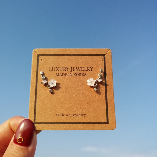 Hand carved flower earrings